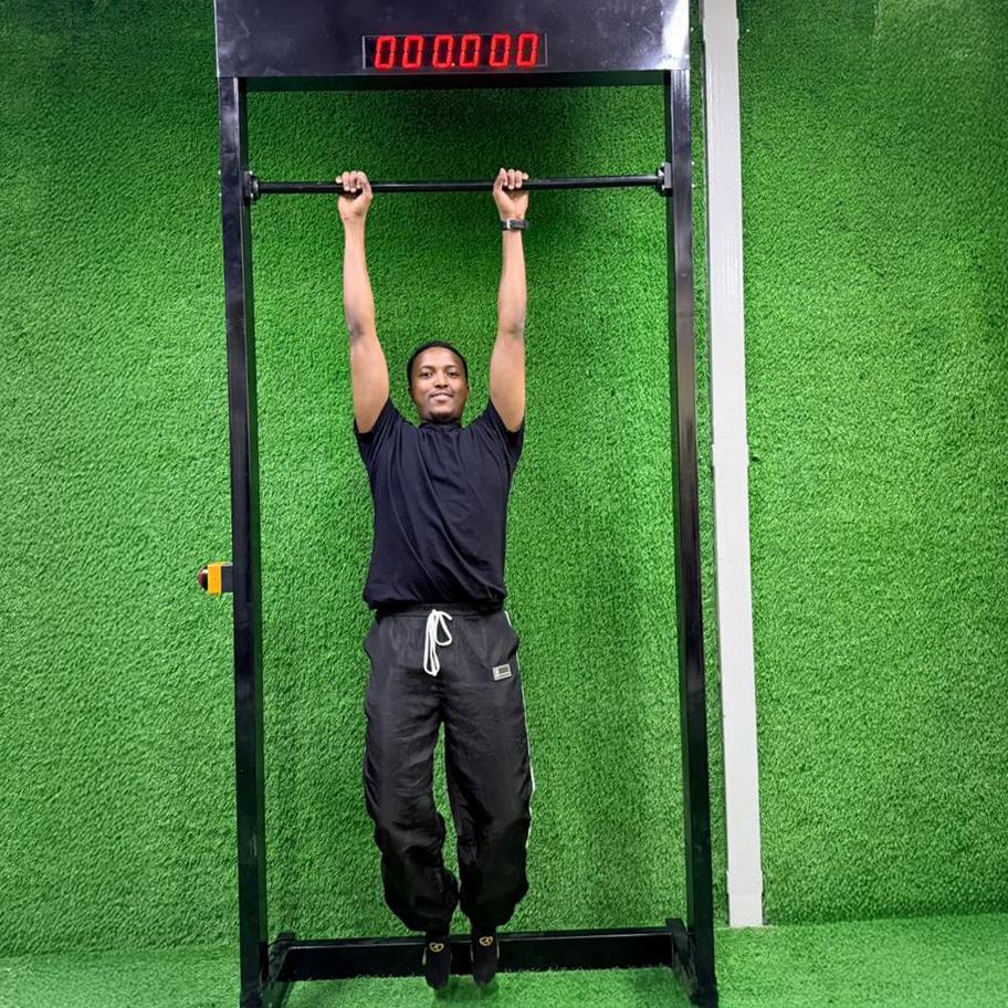 Viral 100-Second Hanging Challenge arcade machine rental for corporate events in Dubai, featuring a digital timer and participants testing their grip strength.
